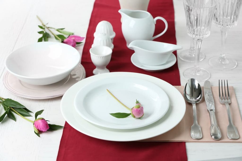 white dinner setting with rosebuds